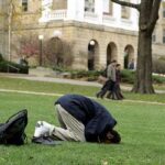 practicing prayer, muslim student praying, student offering prayer